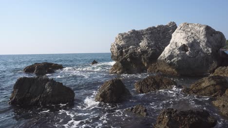 Steady-shot-of-big-rocks-in-the-sea-in-sunny-warm-day---Montenegro