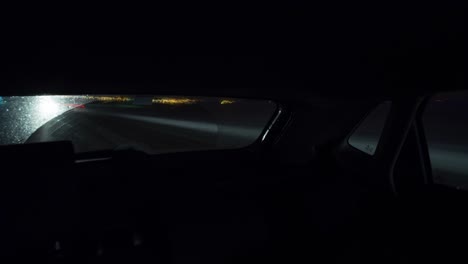 Timelapse-inside-of-a-car-driving-by-night