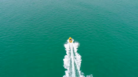 Birds-eye-of-moving-boat-on-water
