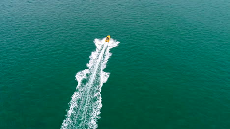 Aerial-follow-of-boat-in-ocean