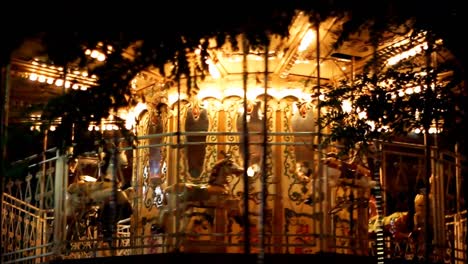 Carousel-horses-spinning-in-circles-on-a-merry-go-round-at-night