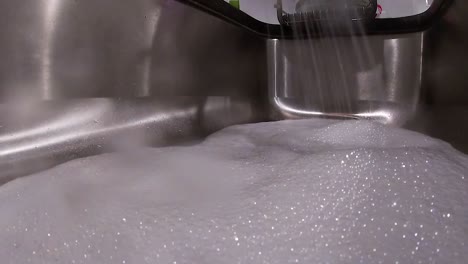 Water-foaming-in-sink-for-dishes