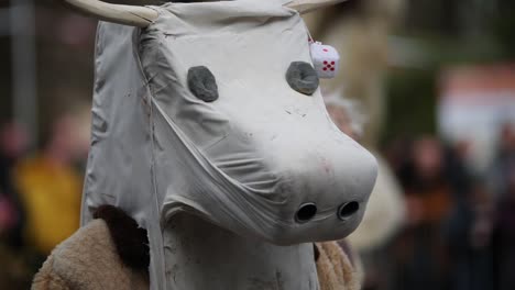 Fake-white-cow-head-mask-with-dices-on-its-horns