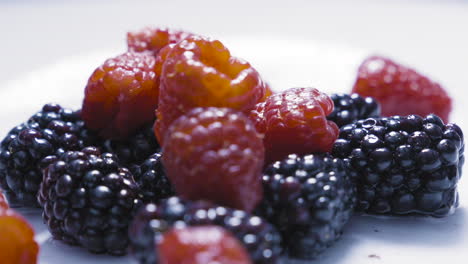 Slowmotion-of-assorted-berrys-falling-on-to-water-4