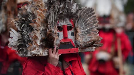 Wooden-masks-with-birdy-feathers-and-red-noses