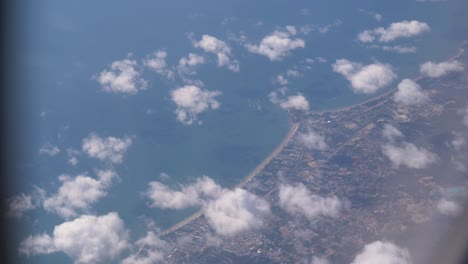 Aerial-view-of-coastline,looking-out-from-airplane-window