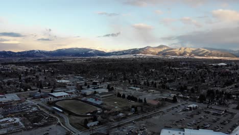 Drone-shot-of-small-town-during-sunset-in-winter