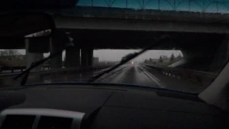 Slow-motion-of-windscreen-wipers-while-passing-under-a-bridge