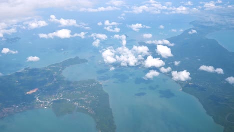 The-airplane-is-flying-over-islands-in-Thailand