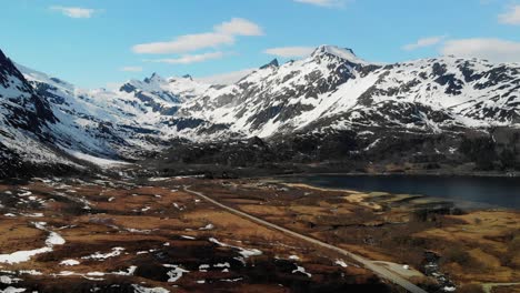 Slow-motion-aerial-of-beautiful-mountains-during-the-spring-in-Lofoten-Islands,-Norway