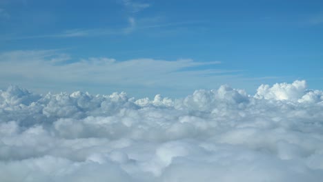 Airplane-flying-over-the-clouds-view-from-cockpit