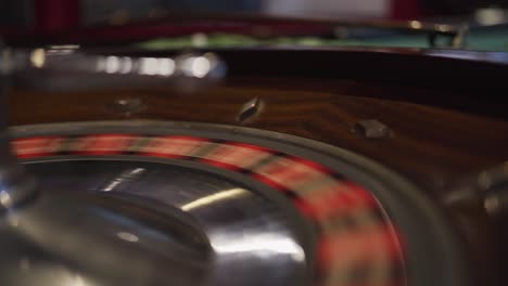A-spinning-roulette-wheel-in-a-casino-with-the-ball-just-dropped-down-and-bouncing-out-of-the-wheel-making-the-round-invalid