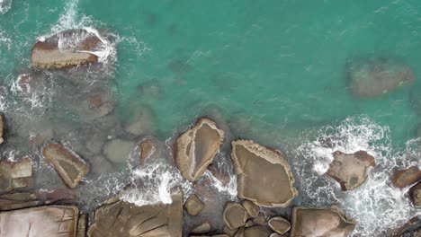 Aerial-view-of-ocean-waves-crashing-on-the-rocks,-Drone-shots-1