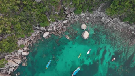 Aerial-view-of-parked-boats-at-the-rock-bay,-Koh-Tao-Thailand