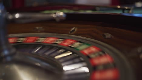 An-empty-spinning-roulette-wheel-in-a-casino-waiting-for-the-Croupier-to-drop-the-ball-that-will-land-on-a-number-for-a-lucky-winner