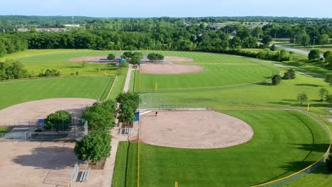Drone-footage-of-a-son-and-his-dad-practicing-baseball-on-a-baseball-diamond