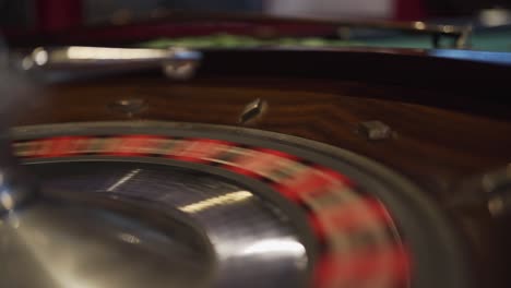 A-spinning-roulette-wheel-in-a-casino-with-the-ball-just-dropped-down-spinning-and-waiting-to-land-on-a-number
