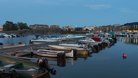 Timelapse-of-a-pier-filled-with-leisure-boats-located-in-Karlskrona,-Sweden
