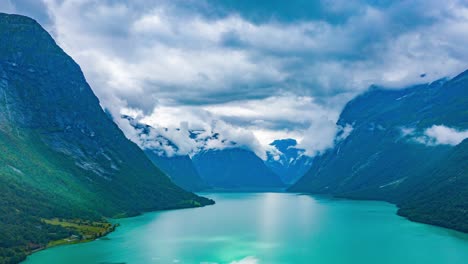 Stormy-clouds-passing-over-the-turquoise-water-of-the-beautiful-Lovatnet-lake,-in-the-municipality-of-Stryn-in-Sogn-og-Fjordane-county,-Norway