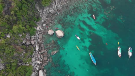 Aerial-view-of-parked-boats-at-the-rock-bay,-Koh-Tao,Thailand