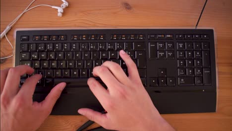 Young-man-is-writting-a-text-on-his-computer-using-a-keyboard-8