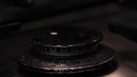 Close-up-of-Smaller-Gas-Hob-Ring-Igniting-to-Flame-on-Cooker