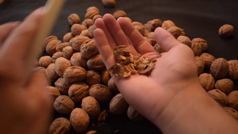 Young-man-is-cracking-some-fresh-dried-walnuts-6