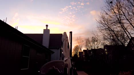 Sunset-in-the-backyard-of-a-house-in-a-neighborhood-timelapse