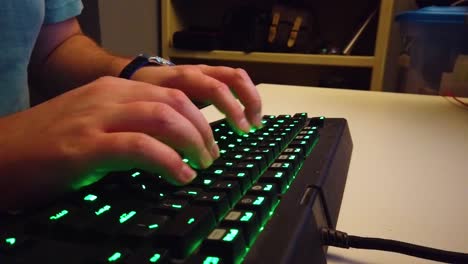 Typing-on-a-green-gaming-keyboard