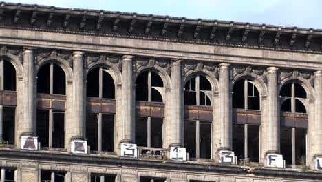 Broken-Windows-on-top-of-of-Michigan-Central-Station-in-Detroit,-Michigan,-USA