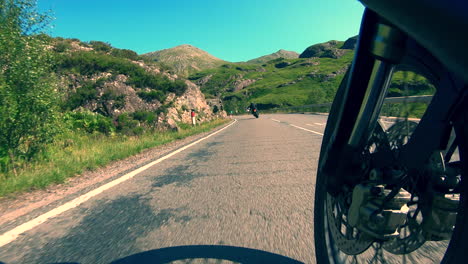 Motorcycles-on-the-open-road-through-the-mountains-of-Glencoe-Scotland