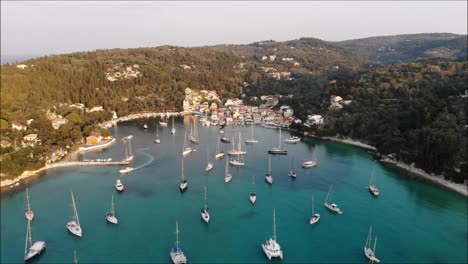 Drone-flying-over-blue-water-and-yachts
