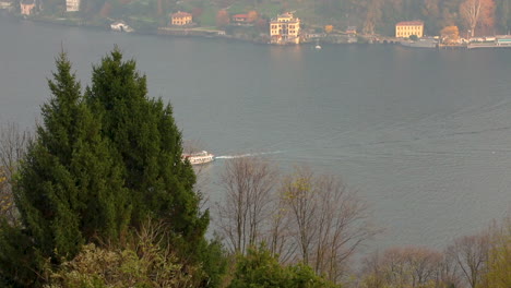 View-of-the-boat-from-the-hills-on-Lake-Como-in-an-emotional-autumn-day