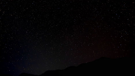 Night-sky-timelapse-over-a-hill-as-seen-from-Bhujung-Village,-Lamjung,-Nepal