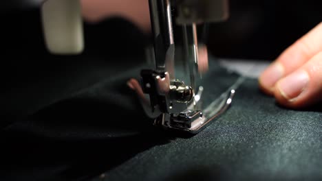 Closeup-of-guy-sewing-with-sewing-machine