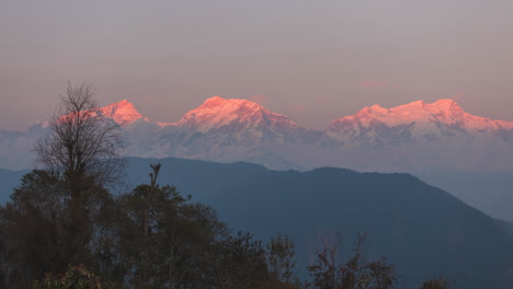 Golden-Hour-Evening-timelapse-of-sun-rays-leaving-the-Annapurna-Mountain-Range-as-seen-from-Ghan-Pokhara,-Lamjung,-Nepal