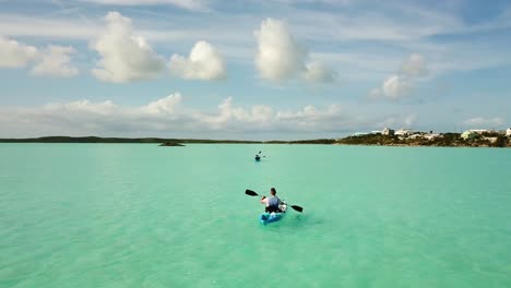 Kayaker-paddling-on-the-ocean-off-the-coast-of-Providenciales-in-the-Turks-and-Caicos-archipelago