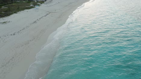 Quiet-sandy-beach-on-Grand-Turk-Island-in-the-Turks-and-Caicos-Archipelago-at-sunset
