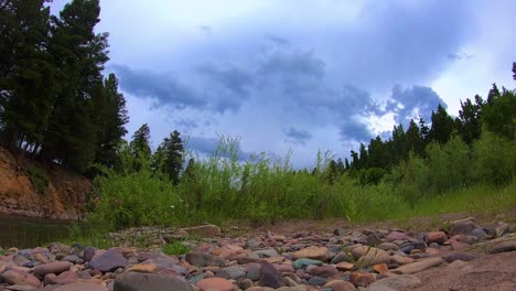 Time-lapse-of-thunder-clouds-rolling-in-over-a-river