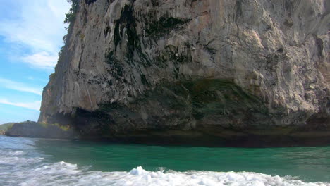 SLOW-MOTION-|-Close-up-of-rock-formations-coming-out-of-the-water-in-Thailand