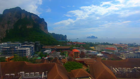 SLOW-MOTION-|-Reveal-of-the-view-from-a-hotel-in-Thailand-with-the-ocean-and-mountains-in-the-distance