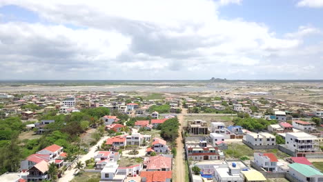 Revealing-drone-shot-flying-towards-the-beach-town-of-Playas-General-Villamil-in-Ecuador