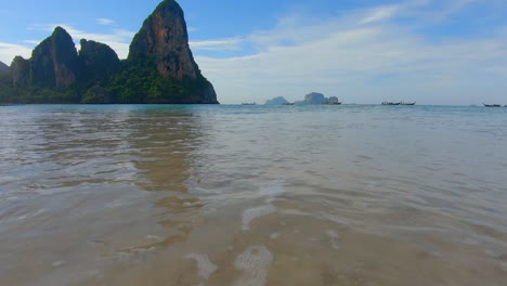 SLOW-MOTION-|-Waves-crashing-on-the-beach-in-Thailand-with-Islands-off-in-the-distance