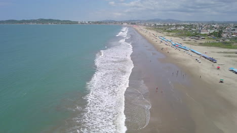 Drone-shot-flying-over-the-beach-in-the-town-of-Playas-General-Villamil,-Ecuador-3