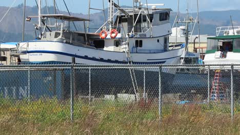 Port-of-Astoria-Boatyard-closeup-of-blue-and-white-fishing-boat-on-a-sunny-day-in-2020