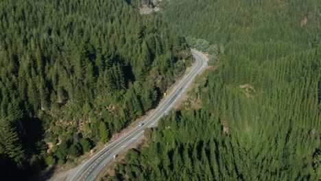 Dolly-zoom-aerial-of-van-on-forest-road