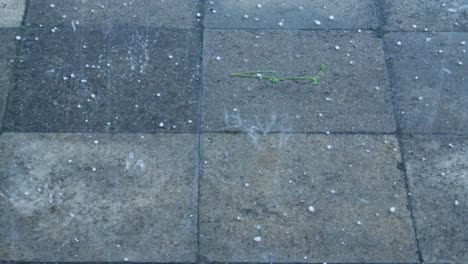 Falling-Ice-Raindrops-On-Paving-Tiles