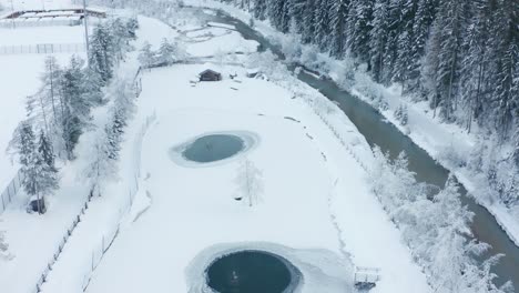 Aerial-view-of-a-frozen-lake-in-San-Vigilio,-Italy