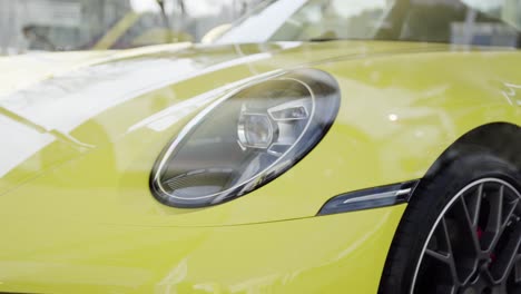 Front-end-of-modern-yellow-super-car-with-some-details-in-4K