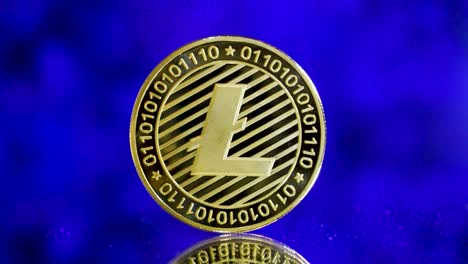Shining-Golden-Litecoin-On-A-Mirroring-Ground-With-Futuristc-Blue-Background